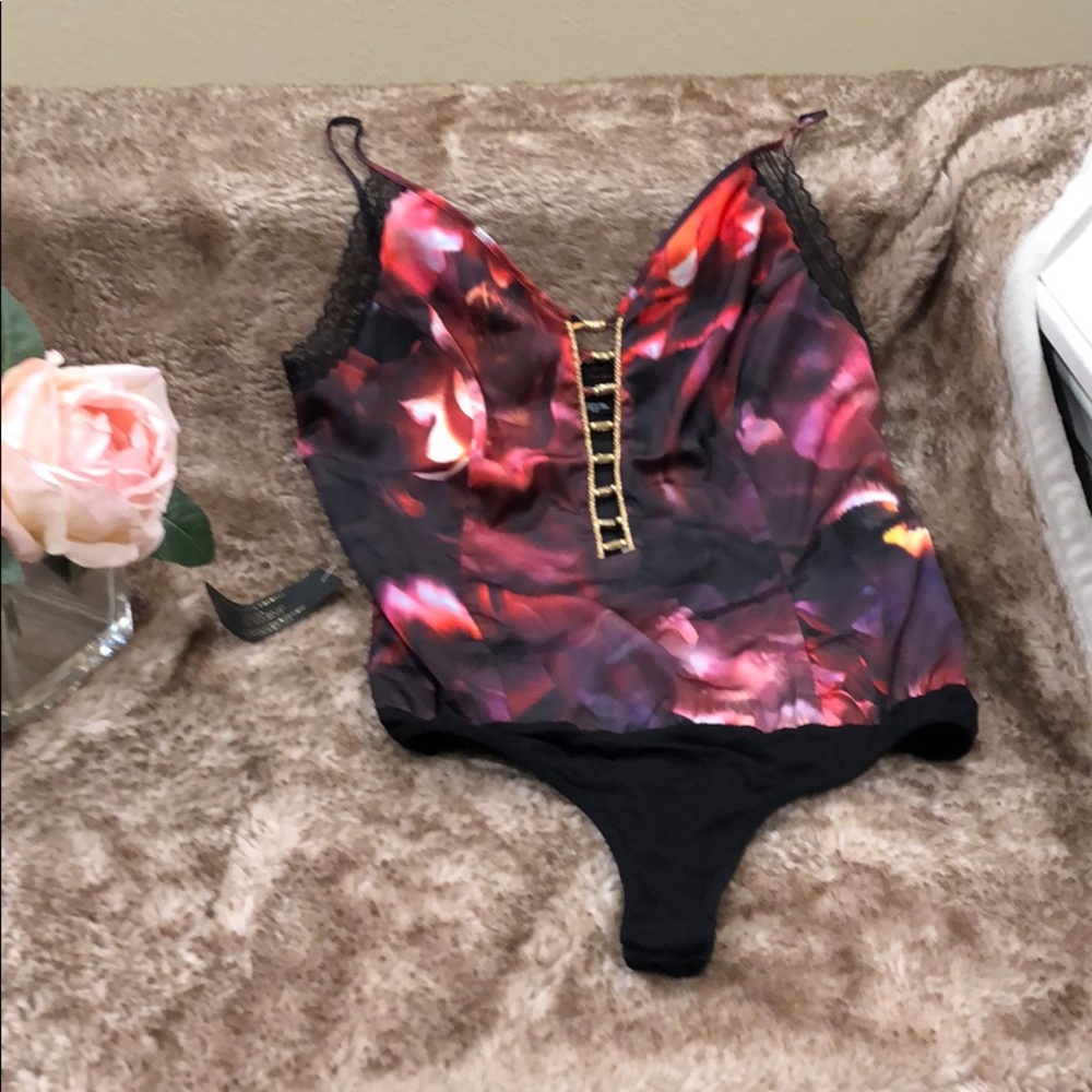 Beautiful multi colored one piece Bebe blouse